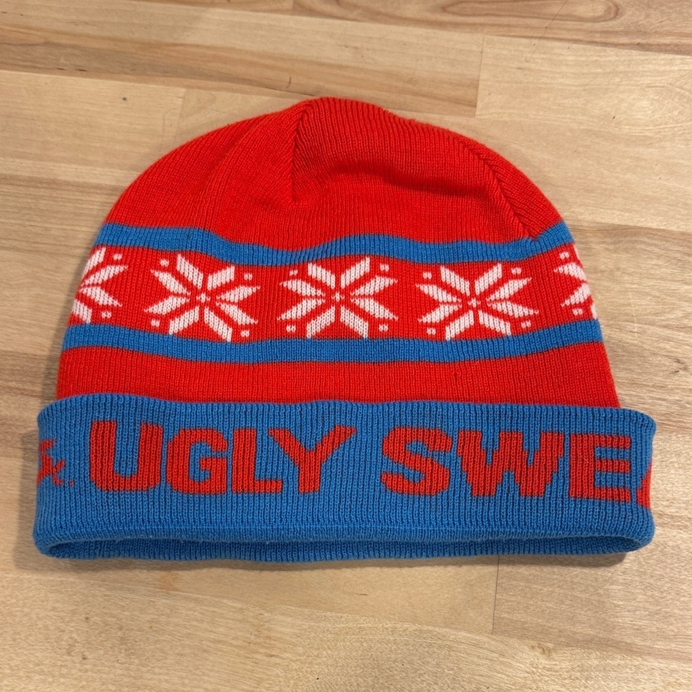 Red and Blue Knit Beanie Hat with Festive Snowflake Pattern
